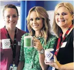  ??  ?? ANGELS At hospital with devoted midwives Natalie Carter and Pippa Nightingal­e