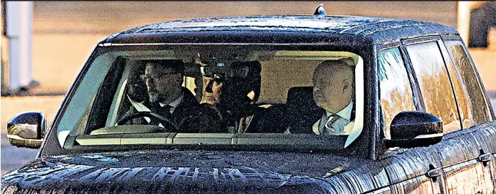  ?? ?? Prince Andrew and his lawyer Gary Bloxsome are driven from the Royal Lodge to Windsor Castle after being summoned by Her Majesty