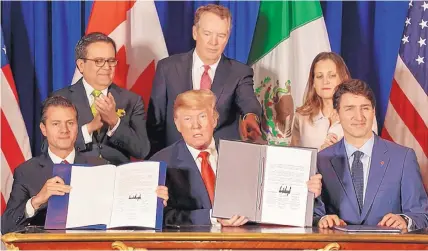  ?? SARAH PABST/BLOOMBERG NEWS ?? Enrique Peña Nieto, Mexico’s president, U.S. president Donald Trump, and Justin Trudeau, Canada’s prime minister, at last year’s signing ceremony for the United States-Mexico-Canada Agreement.