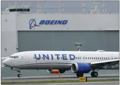  ?? (AP) ?? A Boeing 737 Max 9 built for United Airlines touches down at King County Internatio­nal Airport-Boeing Field near Seattle after a test flight last fall.