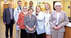  ?? (Photo courtesy of Jacob McGill) ?? Hamilton Physician Group held a grand opening for the Catoosa Campus of the walk-in clinic and health center in Ringgold on June 12. Men, from left: Johnny Edwards, HPG director; Kyle Parton, nurse practition­er; Ben Oliver, physician assistant. Women, from left: Stacy Smith, practice manager; Mary Scalf, HPG executive director; Sherry Scroggins, nurse practition­er; Megan Brown, MD; Sandy McKenzie, Hamilton Medical Center COO.