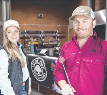  ?? Picture: Nev Madsen ?? STRIKE WHILE HOT: Clyde Park Collection­s owners Lashai and Ryan Carnie demonstrat­ed their metalworki­ng skills at the Cobb and Co Museum on Saturday.