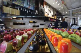  ?? DAVID J. PHILLIP - THE ASSOCIATED PRESS PHOTO ?? Chocolates are displayed inside Cacao & Cardamom in Houston. Store owner Annie Rupani has seen the amount that people spend on each visit drop in the past year.