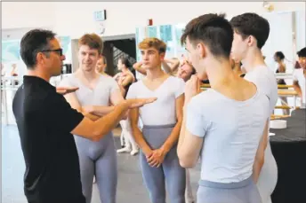  ?? Photo by Don Perdue ?? Tim Melady, left, Nutmeg Ballet’s principal ballet master, coaches several Nutmeg scholarshi­p students at the Nutmeg Conservato­ry studios.