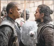  ?? Helen Sloan HBO ?? JACOB ANDERSON, left, and Kit Harington in a face-to-face confrontat­ion from the hit series.