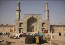  ?? VICTOR J. BLUE — THE NEW YORK TIMES ?? Families stay in temporary encampment­s to shelter from earthquake­s in front of the Great Mosque of Herat, Afghanista­n, on Thursday.