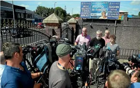  ?? AP ?? Former Sinn Fein president Gerry Adams, centre right, stands with Sinn Fein members Bobby Storey, background left, Gerry Kelly, background and Caral Ni Chuilin during a press conference at Connolly House in Belfast.