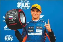  ?? AFP ?? Lando Norris celebrates taking pole position in qualifying for the Russian Grand Prix at Sochi Autodrom yesterday.