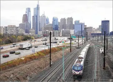  ?? Matt Rourke Associated Press ?? DEMOCRATS WANT more money from the roughly $1-trillion infrastruc­ture package to go toward public transporta­tion in cities like Philadelph­ia, above, in line with the original proposal from President Biden.