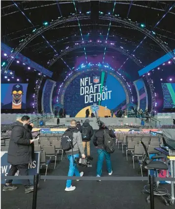 ?? PAUL SANCYA/AP ?? Preparatio­ns take place earlier this week for the NFL draft in Detroit. The first round is Thursday night.