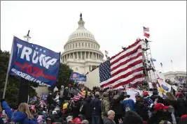  ?? JOSE LUIS MAGANA — THE ASSOCIATED PRESS FILE ?? Rioters stand outside the U.S. Capitol in Washington.