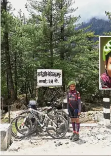  ??  ?? Strength and stamina: Nur Azhani (inset) stopping for a break en route to the peak of Thorong La Pass at the Himalayan range in Nepal.