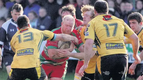  ??  ?? ● This Pwllheli attack is crowded out by Nant Conwy during Saturday’s North Wales Cup tie at Parc Bodegroes. Pic: RICHARD BIRCH