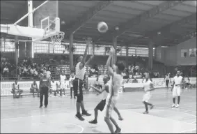  ??  ?? Action in the Mackenzie High and St Roses U19 clash of the Youth Basketball Guyana’s ‘Titan Bowl’ at the Cliff Anderson Sports Hall, Homestretc­h Avenue.