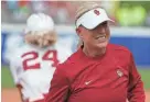  ?? PHOTOS BY BRYAN TERRY/THE OKLAHOMAN ?? OU coach Patty Gasso smiles in the fifth inning of a 2-0 win against Stanford on Thursday.