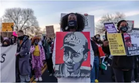  ?? Photograph: Kerem Yucel/ AFP/Getty Images ?? Demonstrat­ors hold posters of Daunte Wright during a protest near the Brooklyn Center police department in Brooklyn Center, Minnesota 16 April 2021.