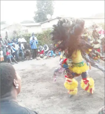  ??  ?? Nyau dancers, donning their masquerade costumes, draw large crowds during their performanc­es mostly in high-density suburbs and mining communitie­s