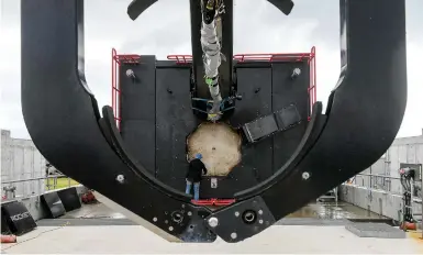  ?? ?? Rocket Lab engineer RJ Smith works on the Rocket Lab launchpad as they prepare to launch satellites from NASA'S Wallops Flight Facility in 2020. (Jonathan Newton/ The Washington Post)