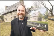  ?? File photo ?? Duo Dickinson is photograph­ed with a book he co-authored, “A Home Called New England,” in front of the Henry Whitfield House in Guilford.