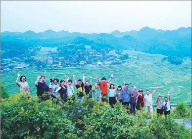  ?? LUO KANGFEI / FOR CHINA DAILY ?? Science fiction writers pose for a photo in Danzhai, Guizhou province, in June 2018.