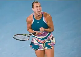  ?? ANTHONY WALLACE/AFP ?? Aryna Sabalenka reacts after a point against Elena Rybakina during the Australian Open final on Saturday in Melbourne. Sabalenka won the match 4-6, 6-3, 6-4 to capture her first Grand Slam title.