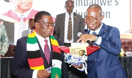  ?? — Picture: Innocent Makawa ?? President Mnangagwa launches the book titled, “Redefining Zimbabwe Education System: ED Mnangagwa’s Vision and Transforma­tional Leadership”,with the help of Higher and Tertiary Education, Innovation, Science, and Technology Developmen­t Minister Professor Amon Murwira in Harare yesterday.