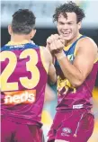  ?? Picture: GETTY IMAGES ?? Cam Rayner celebrates a goal against the Eagles with Charlie Cameron.