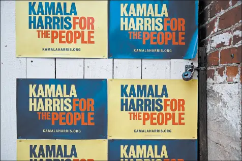 ?? JUSTIN SULLIVAN/GETTY ?? Sen. Kamala Harris signs are displayed outside her Oakland campaign office. Harris quit the presidenti­al race last week.
