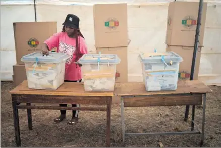  ?? Photo: Mkhululi Thobela/getty Images ?? Boxed in: A woman casts her vote in Harare, Zimbabwe, in August last year in an election that was widely criticised by citizens and internatio­nal observers.