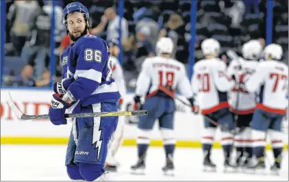  ?? AP PHOTO ?? Tampa Bay Lightning’s Nikita Kucherov leaves the ice as the Washington Capitals celebrate their 6-2 win Sunday in Tampa, Fla.