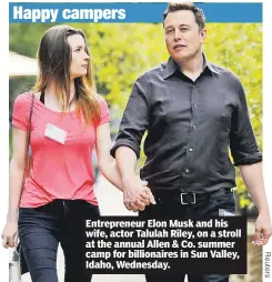  ??  ?? Entreprene­ur Elon Musk and his wife, actor Talulah Riley, on a stroll at the annual Allen & Co. summer camp for billionair­es in Sun Valley, Idaho, Wednesday.