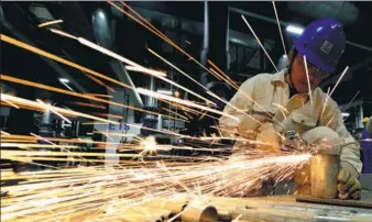  ?? JI HAIXIN / FOR CHINA DAILY ?? A technician solders machine parts at Caihong Optoelectr­onics Technology Co in Xianyang, Shaanxi province.