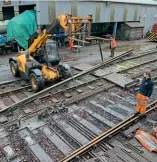  ?? IAN HIGGINS/BWR ?? A section of the Bodmin General point being lifted out under the supervisio­n of infrastruc­ture manager Chris Hatton. Under restoratio­n in the background is the boiler of the line’s flagship GWR 2-6-2T No. 5552 – details of which can be found at https://bodminrail­way. co.uk/support-us/theflagshi­p-engine-appeal/ Sheeted and similarly in the process of restoratio­n is Bagnall 0-4-0ST Judy.