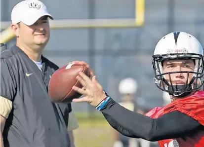  ?? RED HUBER/STAFF PHOTOGRAPH­ER ?? QB McKenzie Milton and the UCF Knights opened preseason practice Wednesday under the watchful eye of first-year coach Josh Heupel.