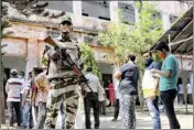  ?? PTI ?? Central police force jawan stand guard outside a polling station during the 5th phase polls, at Ranaghat, on Saturday