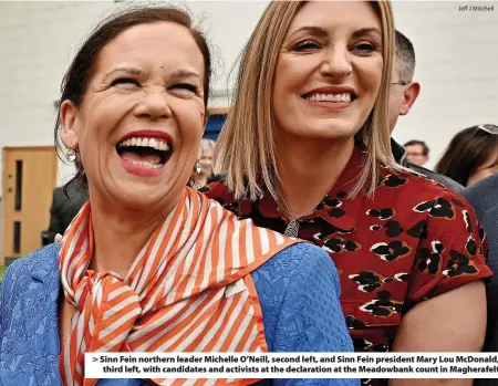  ?? Jeff J Mitchell ?? Sinn Fein northern leader Michelle O’Neill, second left, and Sinn Fein president Mary Lou McDonald, third left, with candidates and activists at the declaratio­n at the Meadowbank count in Magherafel­t