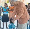  ??  ?? Founder Merrill J. Fernando with MJF Kids at Moratuwa MJF Centre