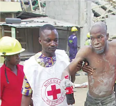  ??  ?? Victim being rescued at a building collapse in Ilasamaja area of Lagos some months ago