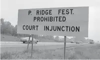  ?? Hearst Connecticu­t Media file photo ?? A sign for traffic heading to the ill-fated Powder Ridge Rock Festival in July 1970.
