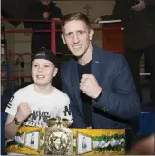  ??  ?? Kayden Healy McGuire with Athy’s Eric Donovan, European bronze medallist and unbeaten profession­al.