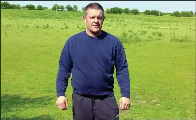  ??  ?? Left with an empty field: Sheep farmer Jason Steeper yesterday at the spot where the flock vanished