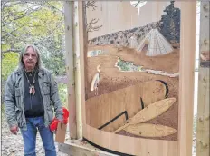  ??  ?? Mi’kmaq artist Ed Benham poses beside his creation, Returning Home, unveiled on Oct. 13 at The Secret Park in Shelburne.