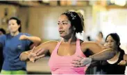  ?? Eddy Matchette /For the Chonicle ?? Trinita Semien of Cypress joins her classmates in their Zumba class at the Juergen’s Hall Community Center in Cypress A variety of classes, programs and activities are now being offered at the facilty.