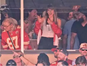  ?? AP PHOTO/CHARLIE RIEDEL ?? Singer Taylor Swift watches Sept. 24 during the first half of the NFL game between the Kansas City Chiefs and the Chicago Bears in Kansas City, Mo.