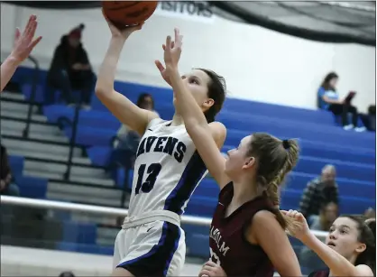  ?? MATTHEW B. MOWERY — MEDIANEWS GROUP ?? Royal Oak’s Anna Waterstred­t (13) puts up a shot over Birmingham Seaholm’s Clara Guffey in the second half of an OAA White girls basketball game on Jan. 22. The Maples got a pair of free throws from Guffey in the final minute, beating host Royal Oak, 34-32.