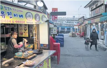  ??  ?? A TASTE OF HOME: A food vendor in Abai, a village made up of North Korean refugees displaced during the 1950-53 Korean War, in the northeast port city Sokcho.