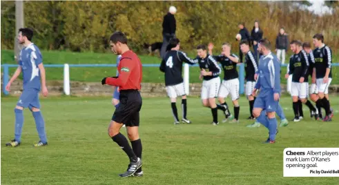  ??  ?? Cheers Albert players mark Liam O’kane’s opening goal.
Pic by David Bell