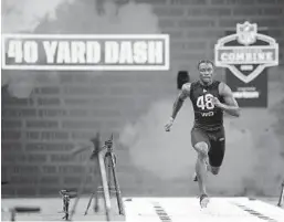  ?? JOE ROBBINS GETTY IMAGES ?? Wide receiver Henry Ruggs III of Alabama was clocked at 4.27 seconds in the 40-yard dash Thursday during the NFL combine, though some scoff at 40 times.