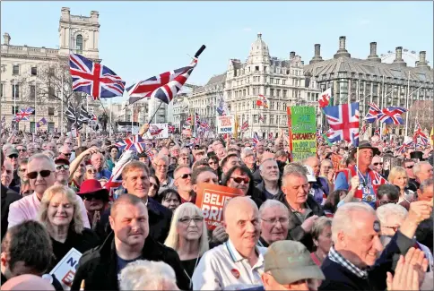  ??  ?? Pro-Brexit supporters wait to listen to speakers at a rally in central London, organised by Leave Means Leave. — AFP photo