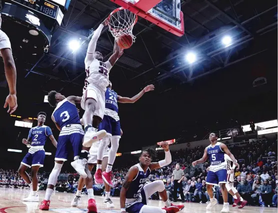  ?? WORSOM ROBINSON/FOR THE SUN-TIMES ?? Belleville West star EJ Liddell filled the stat sheet with 14 points, 11 rebounds, five assists and four blocks Friday against Curie in Peoria.